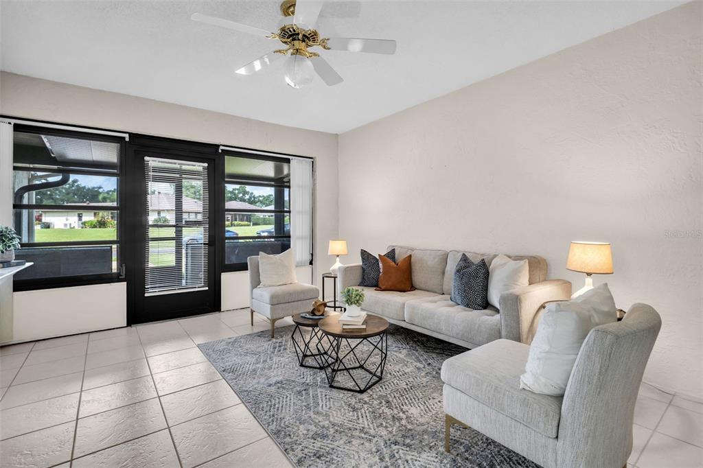 Large front windows allow natural light to flood the space~
