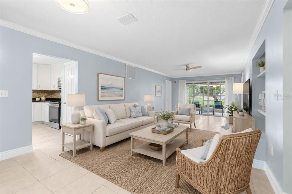 Virtually staged living room with view to patio