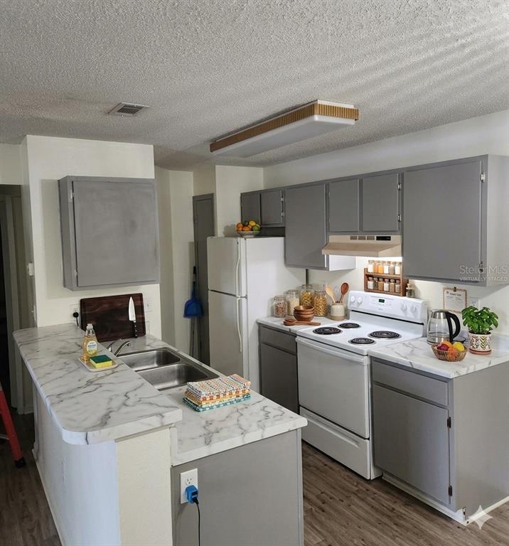 *virtually staged* *new cabinet doors were created and placed in Jan 2026. image was altered to remove construction items on the counter.