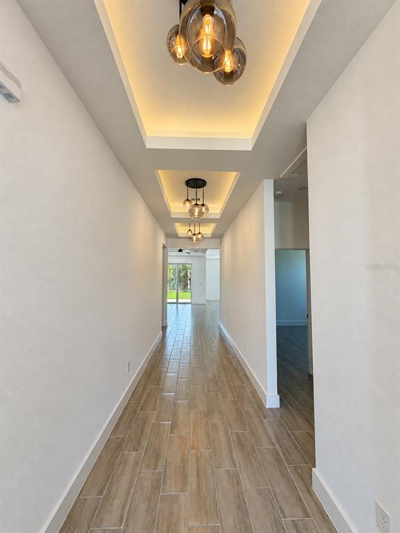 Entry lighting detail. Actual property photo, digitally refined.