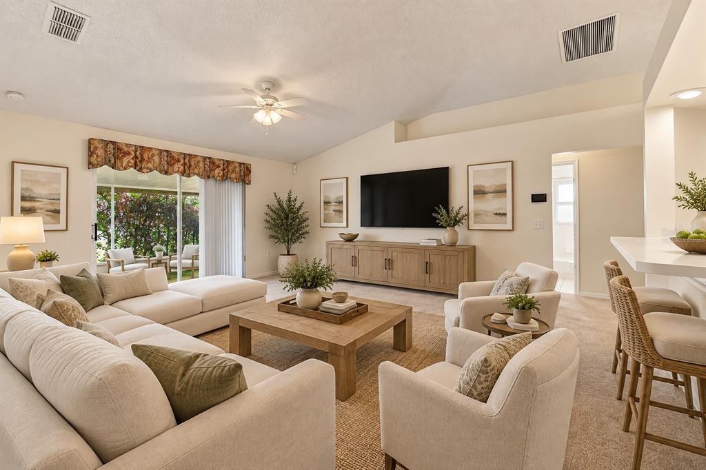 Virtually staged family room  vaulted ceilings