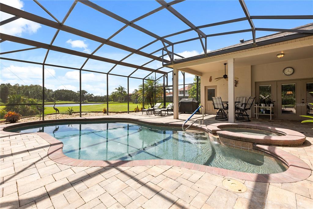 Beautiful pool with gold and pond views on a premium, oversized lot.