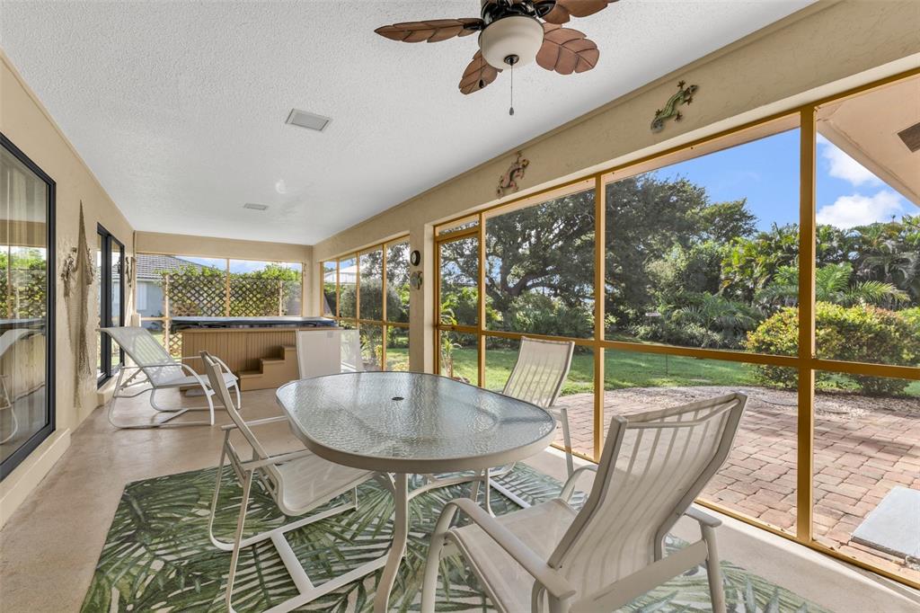 Screened lanai with a relaxing spa. Peaceful setting with room to build a pool.