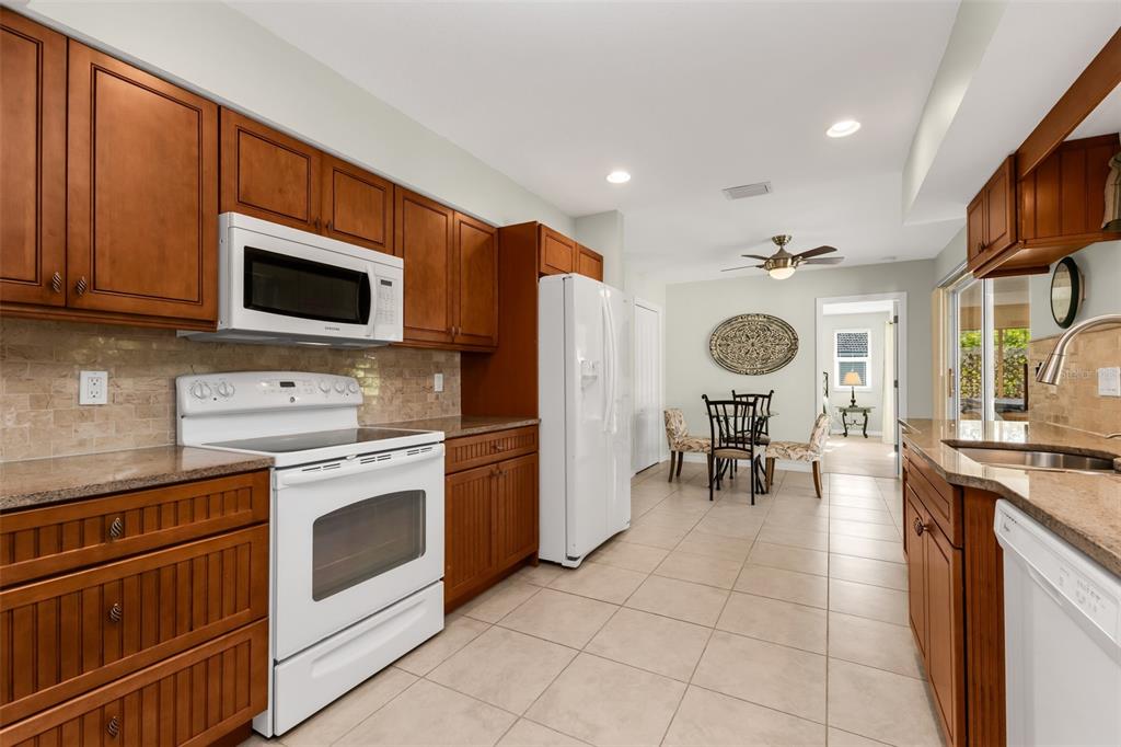 Spacious kitchen with solid wood cabinets and soft-close drawers.