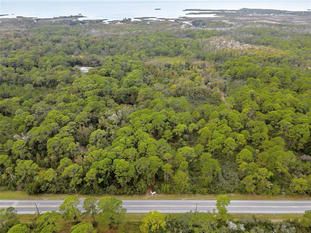 Aerial View Looking West / V-Pattern Sign Marks the Easement Entrance