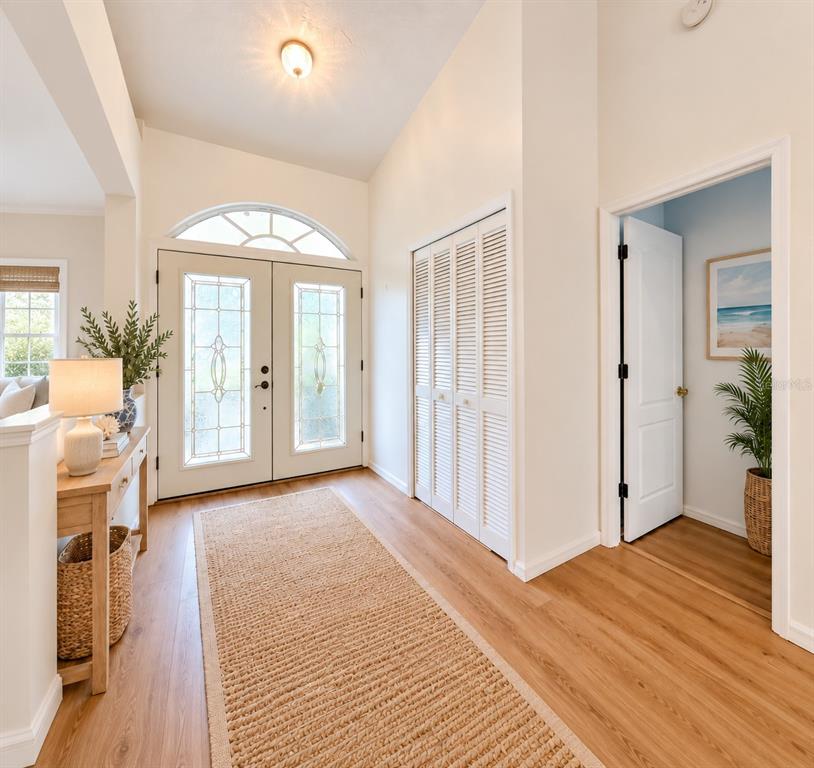 Double glass front doors,wide foyer, high ceilings.