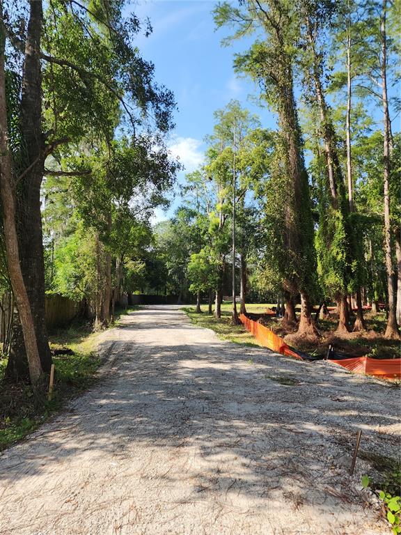 Installed driveway with a cleared, build-ready lot—ready for your new home. The west property line extends 264 feet to the rear, while the east property line stretches approximately 500 feet. The 1.1-acre parcel includes approximately 0.40 acres of upland area, providing a spacious homesite with ample room to build while enjoying the privacy and natural surroundings.