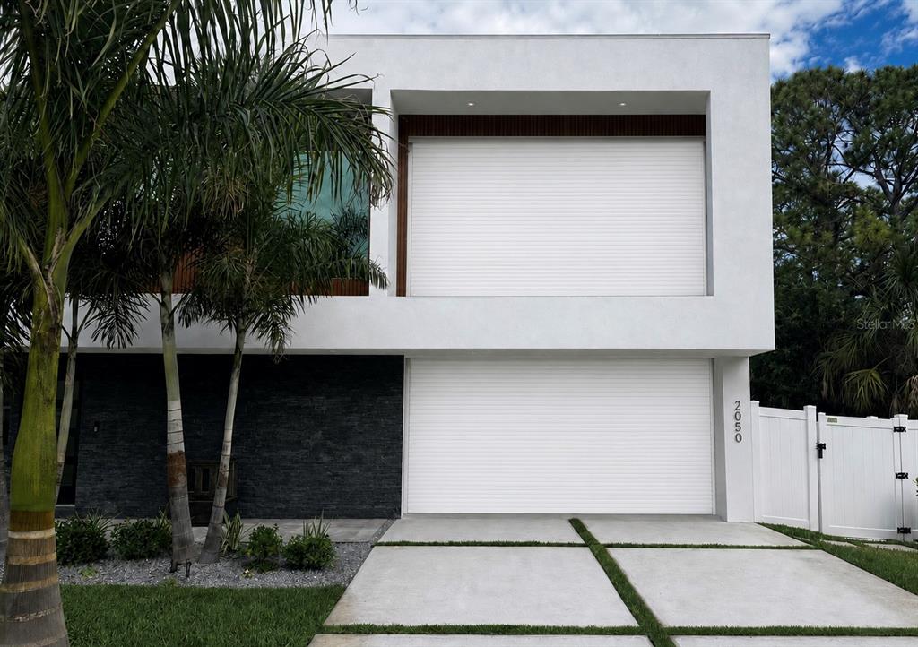 Modern exterior with tropical landscaping.