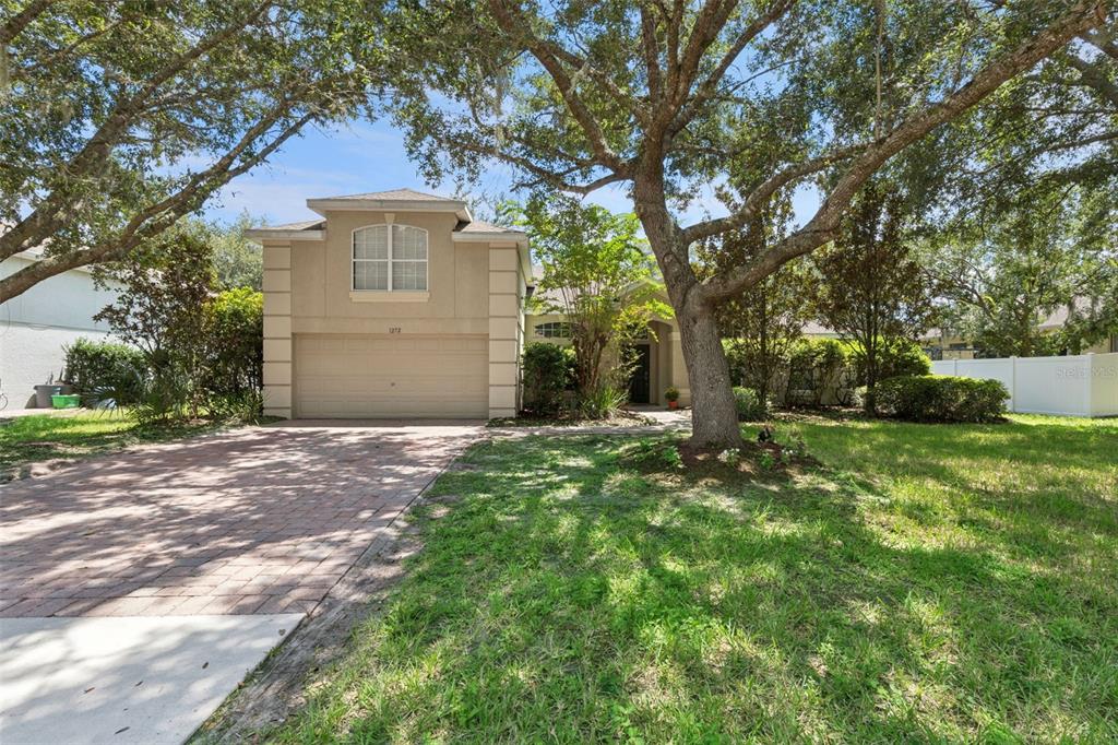Beautiful curb appeal and mature landscaping welcoming you home