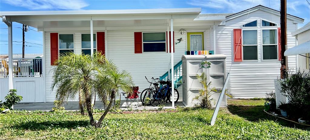 Outdoor patio, new carport, storage shed, tropical color theme