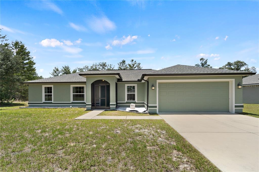 Better than new! Quality-built Wisteria plan with solid stucco siding and a stone address landscape package.