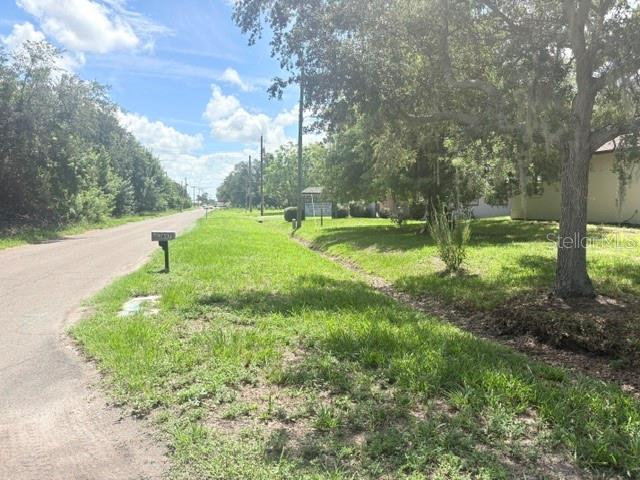 View from street with US 41 in distance. Corner lot and home.