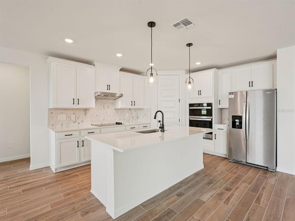 Photo is not of the actual home, but is an inspirational photo of builder’s model home and may depict options, furnishings, and/or decorator features that are not included
