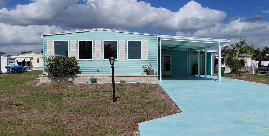 Double Wide Turn-key Furnished, extra wide drive.