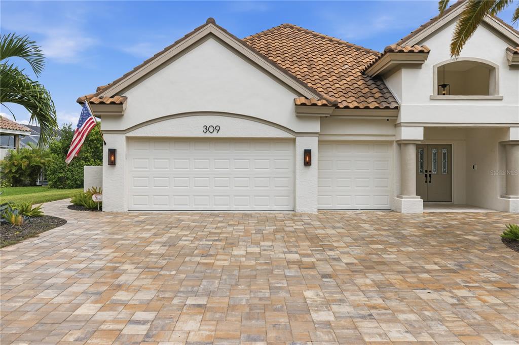 Front of home with 3 car garage shown