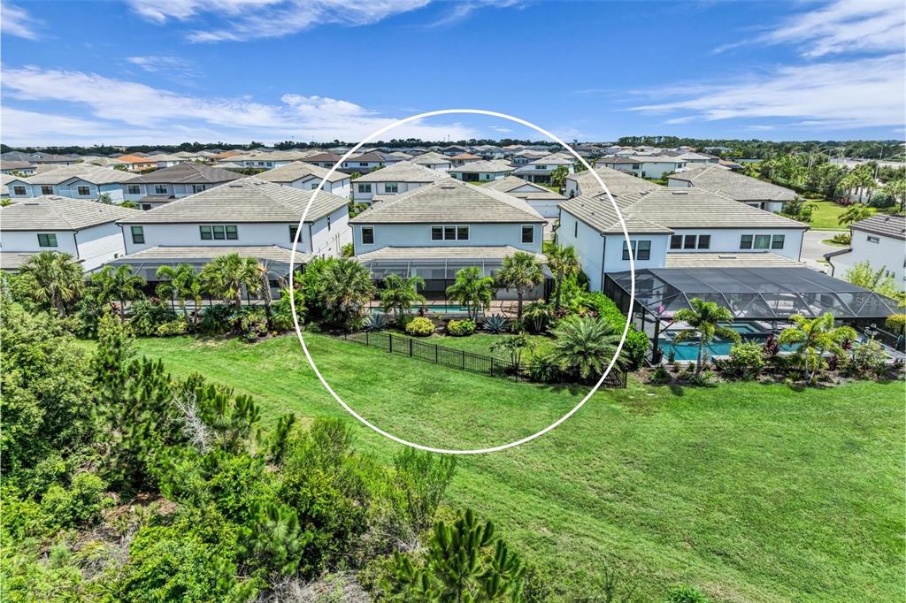 Fully fenced in yard on a private preserve homesite.