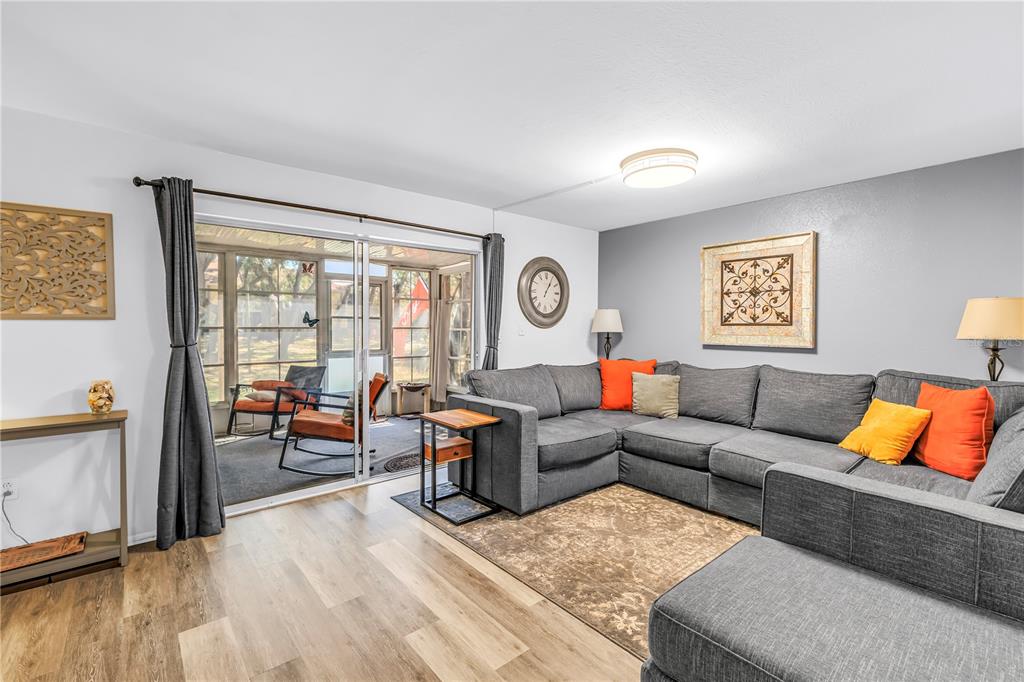 livingroom with sliders to bonus space and park