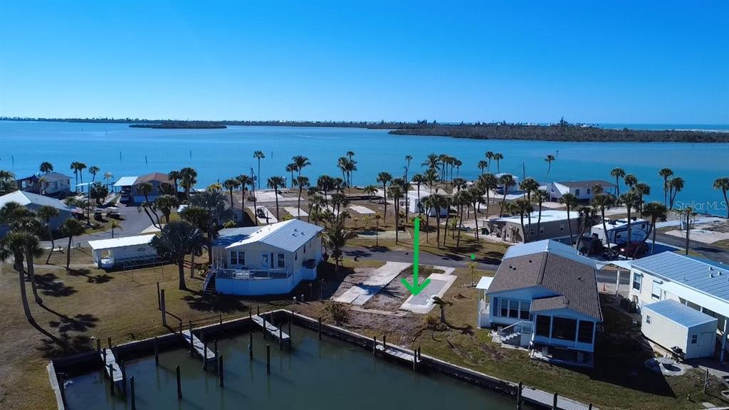 Lot Site facing West with inlet in foreground and Stump Pass of the ICW in the background.