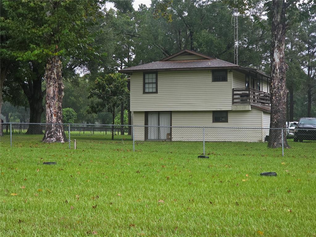 2 story house with deck on North and South sides on a Rainy day