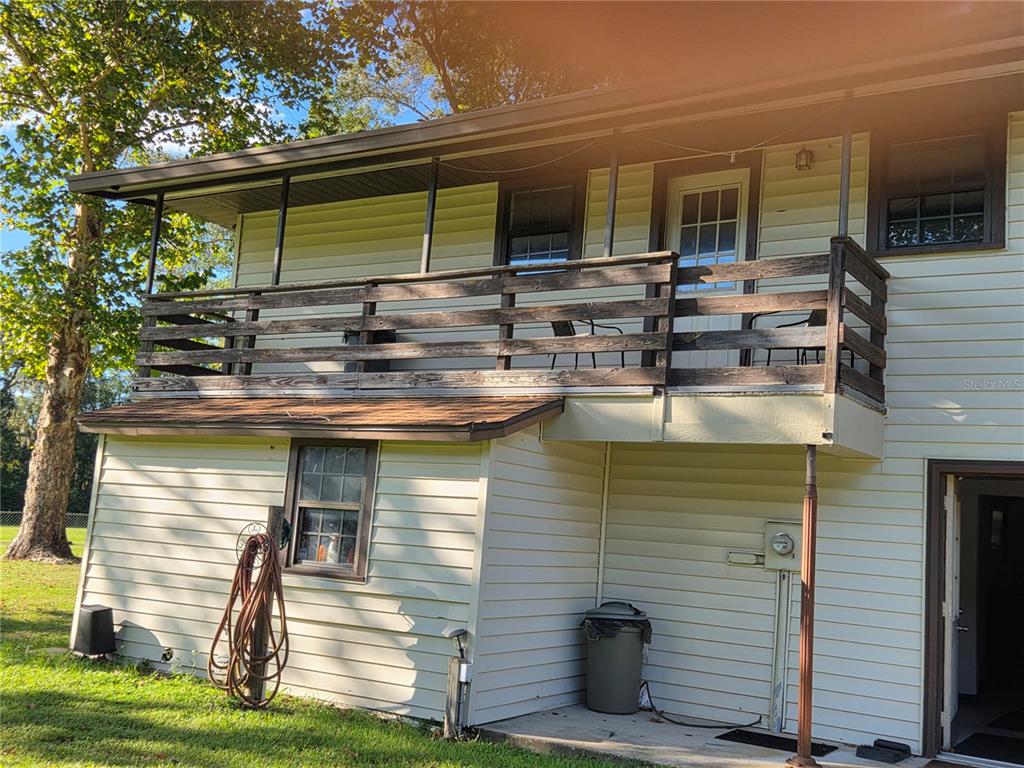 Hanger Side of the house with a Generator transfer switch under the porch by the electric meter