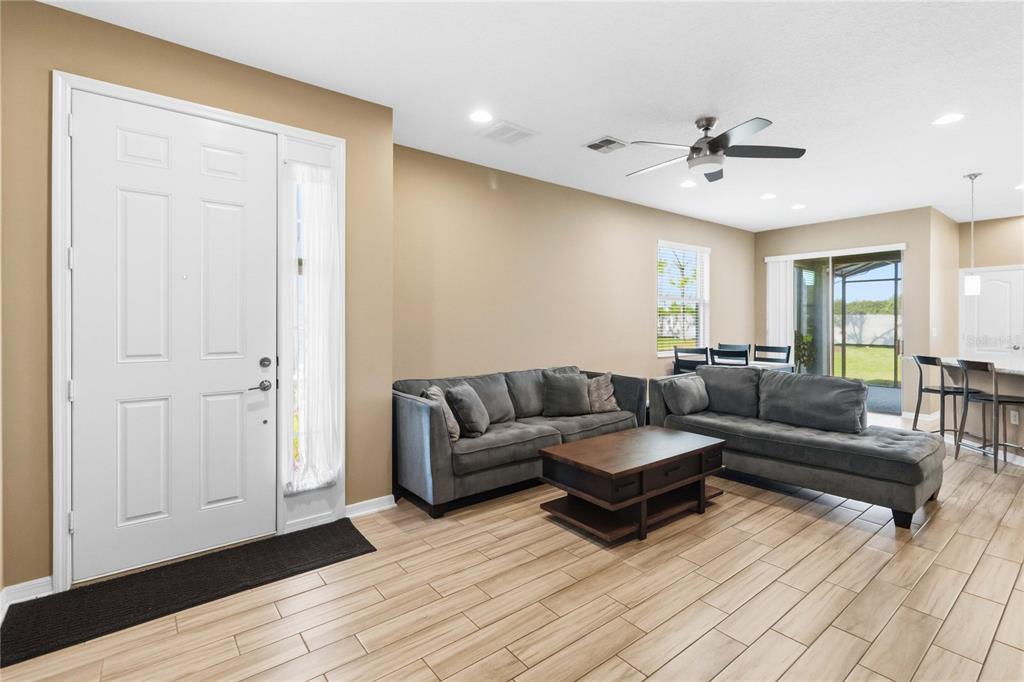 Open-concept living with stylish tile flooring
