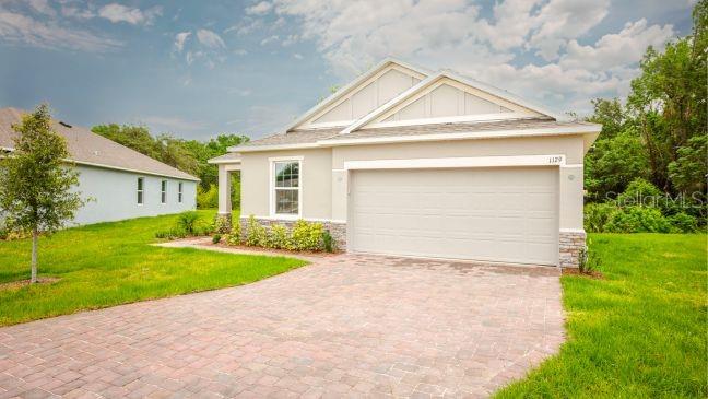 Model home - actual lot & features may vary. - Actual home has a 3-car garage.