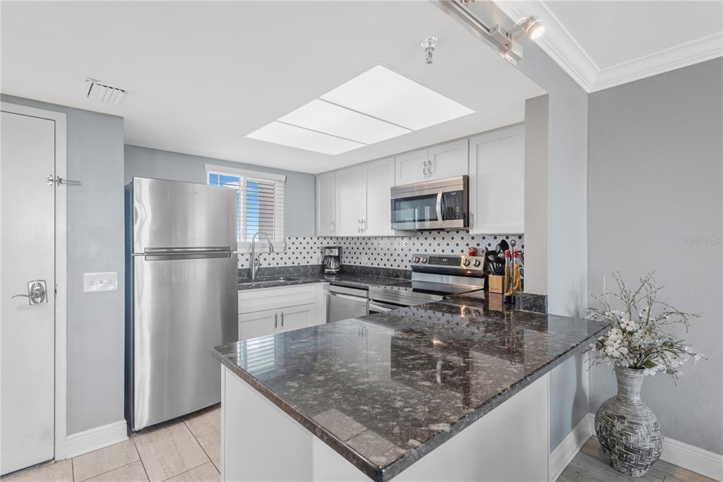 Step inside and experience this exquisite kitchen with stainless appliances, breakast island and beautiful appointments.