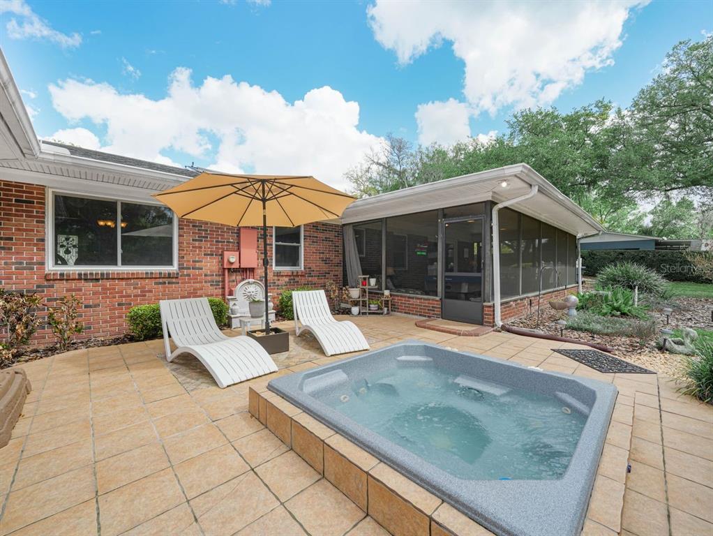 In ground hot tub ovrlooking yard