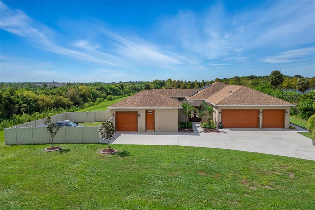 The estate faces north, its entry flanked by 4 garage bays.