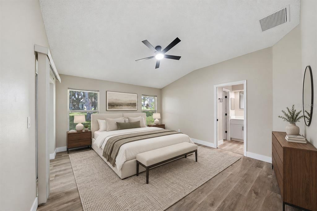 Primary bedroom with ensuite bathroom and private lanai access