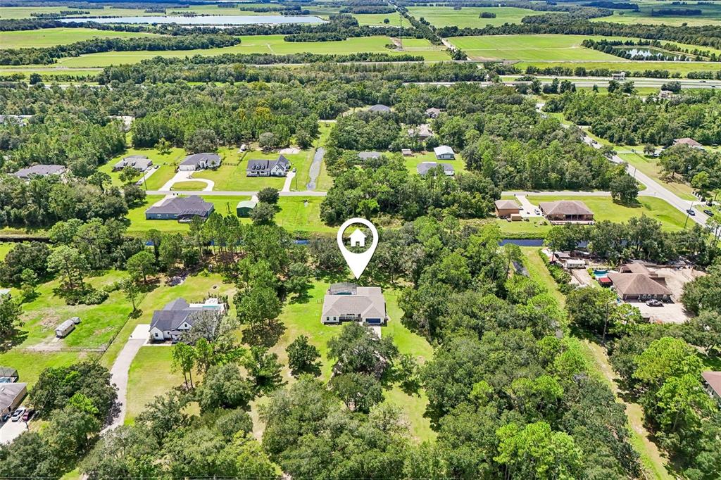 Offering more than 2,800 SQUARE FEET of single-story living space, a canal along the back of the property, NO HOA and a peaceful setting surrounded by trees, this home offers the ROOM TO SPREAD OUT while still providing all the comforts you want.