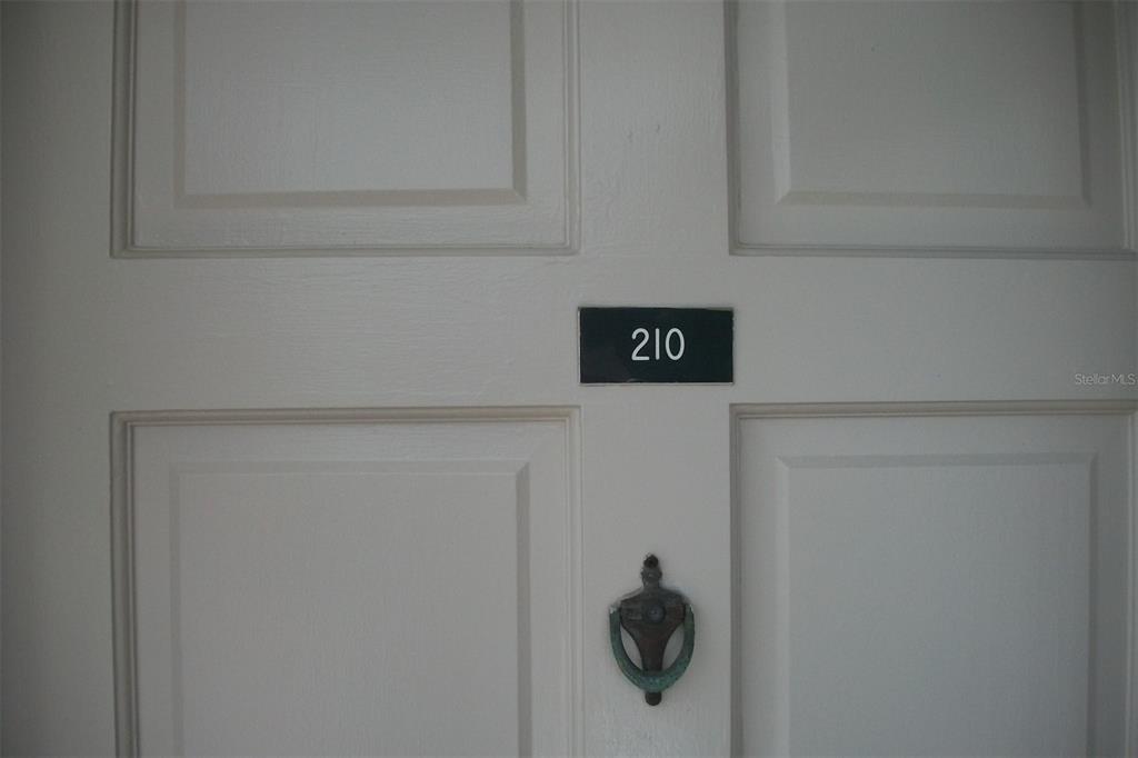 Front Door to second story Condo, Complex located on Lake Seminole with fishing dock