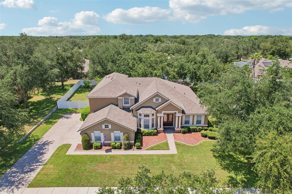 Situated on a large .39 ACRE ~ FULLY FENCED LOT, this spacious home offers 5-BEDROOM POTENTIAL, 4 FULL BATHS, a dedicated OFFICE, upstairs LOFT, THEATER/MEDIA ROOM and 3-CAR SIDE-ENTRY GARAGE!