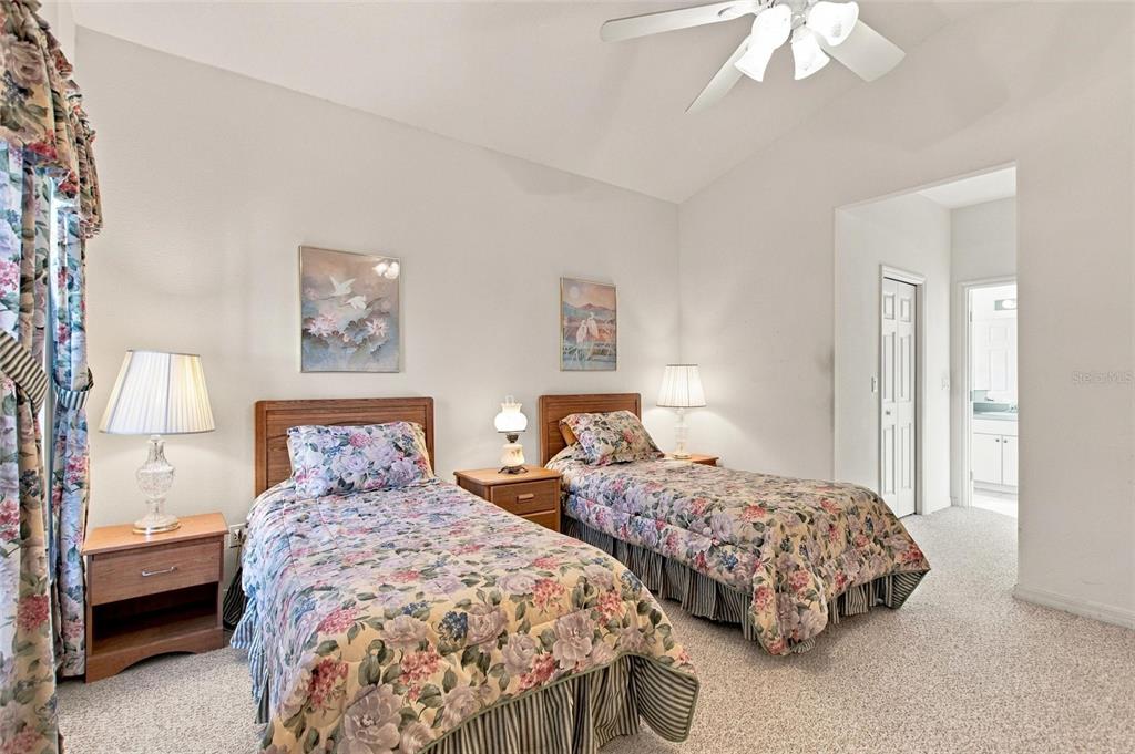 Primary en suite bedroom with two walk in closets