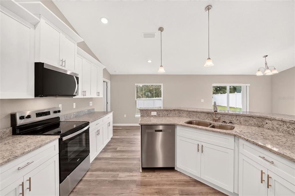Imagine preparing festive dinners in this large kitchen. Love the Granite Countertops