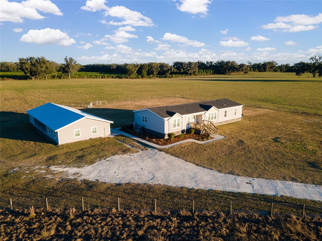 2300+ sq ft home plus addition ADU that includes a 3-car carport, 690 sq ft bonus room and enclosed garage/storage area.