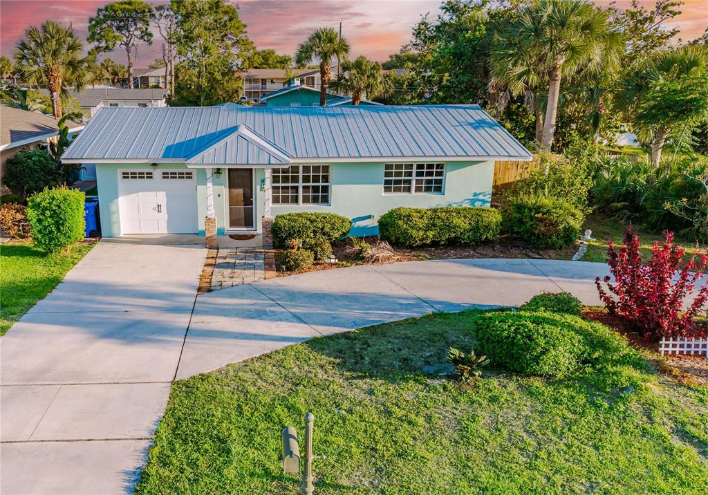 Freshly painted exterior with landscaped front yard