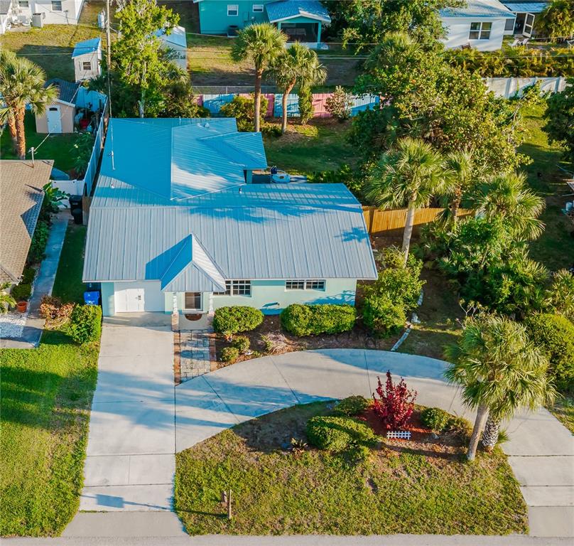 New metal roof.  Circular driveway and garage.