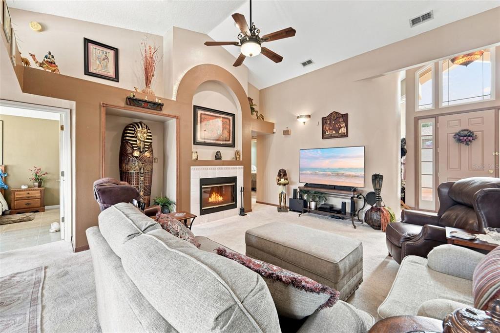 Living area angle towards foyer and bedrooms to the left