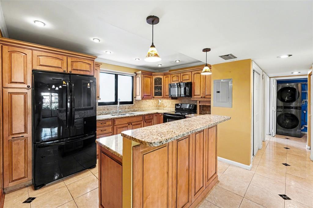 Kitchen (from front entry to the left side)