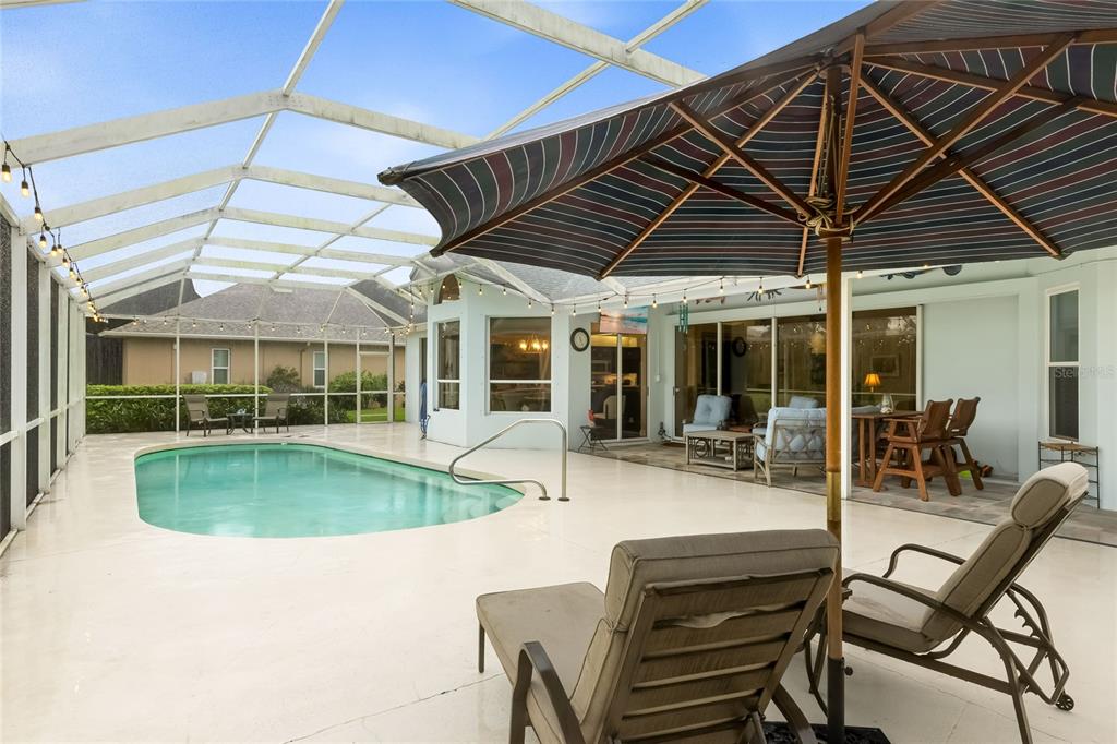 Lounge on your poolside lanai while enjoying the lakeside view