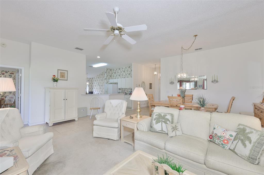 OPEN GREAT ROOM WITH HIGH CEILING WITH NEUTRAL PALETTE.