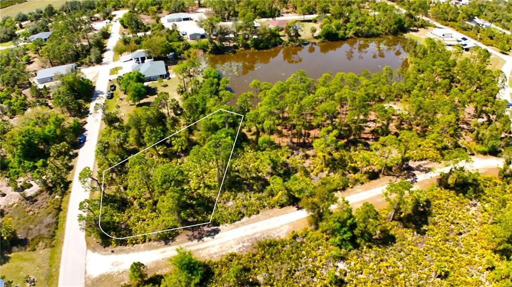 Tropical Gulf Acres lake front lot.