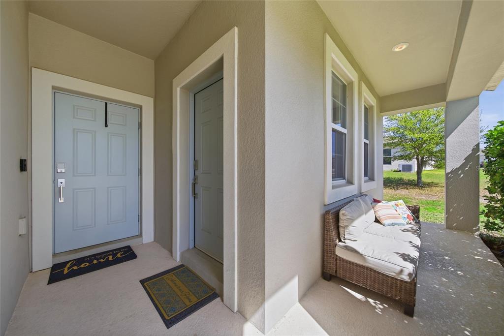 Porch - Main door front center, In Law/ apartment door to the right. L shaped porch