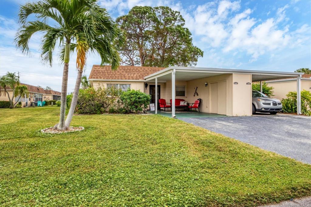 Front of villa with attached carport
