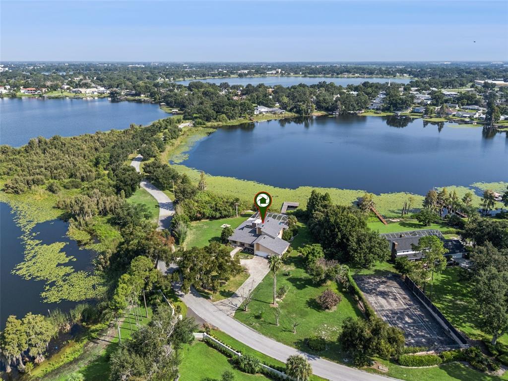 Aerial view showcasing the chain of lakes and private location.