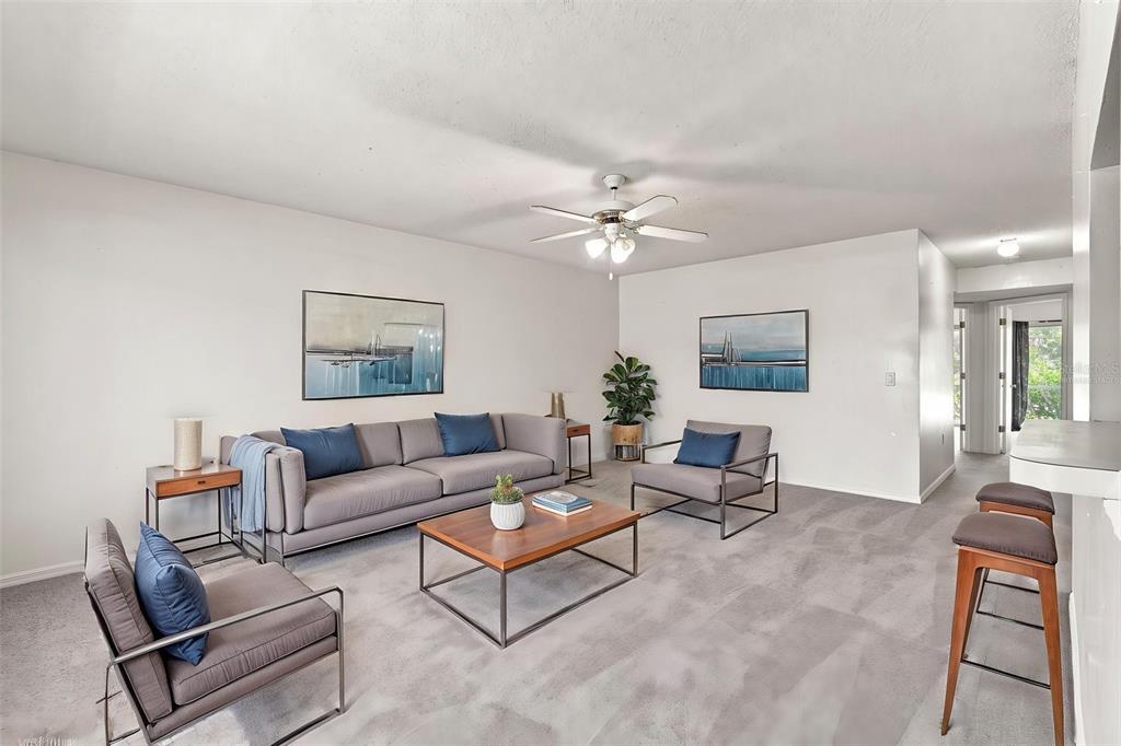 Virtually Staged Spacious Living Room With Pass Thru Bar