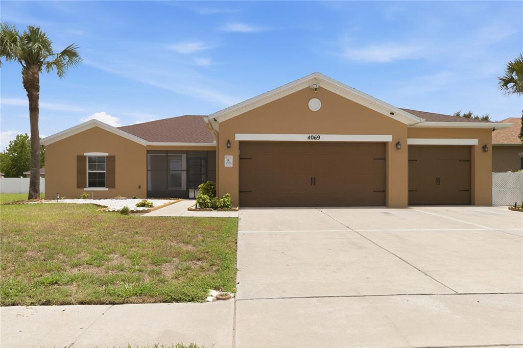Exterior front, 3 car garage, fully fenced