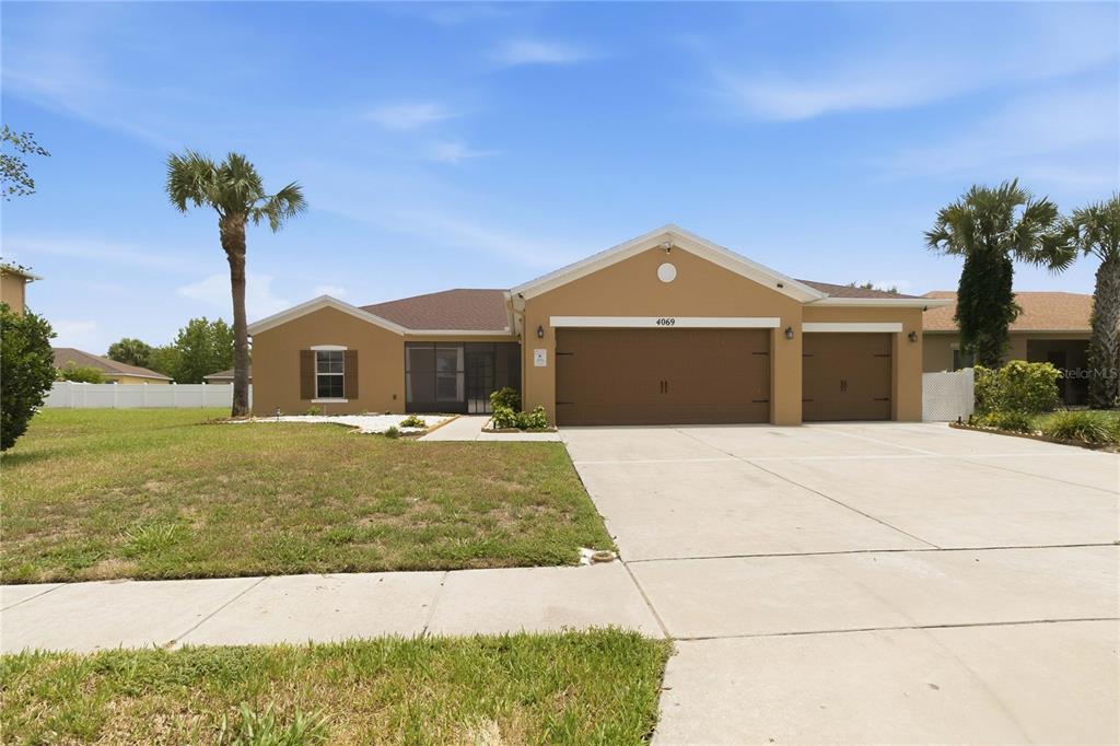 Exterior front, 3 car garage, fully fenced