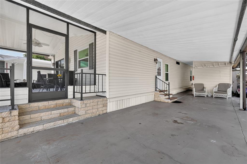 Carport/Entrance to covered screened Lanai/Entrance to Home